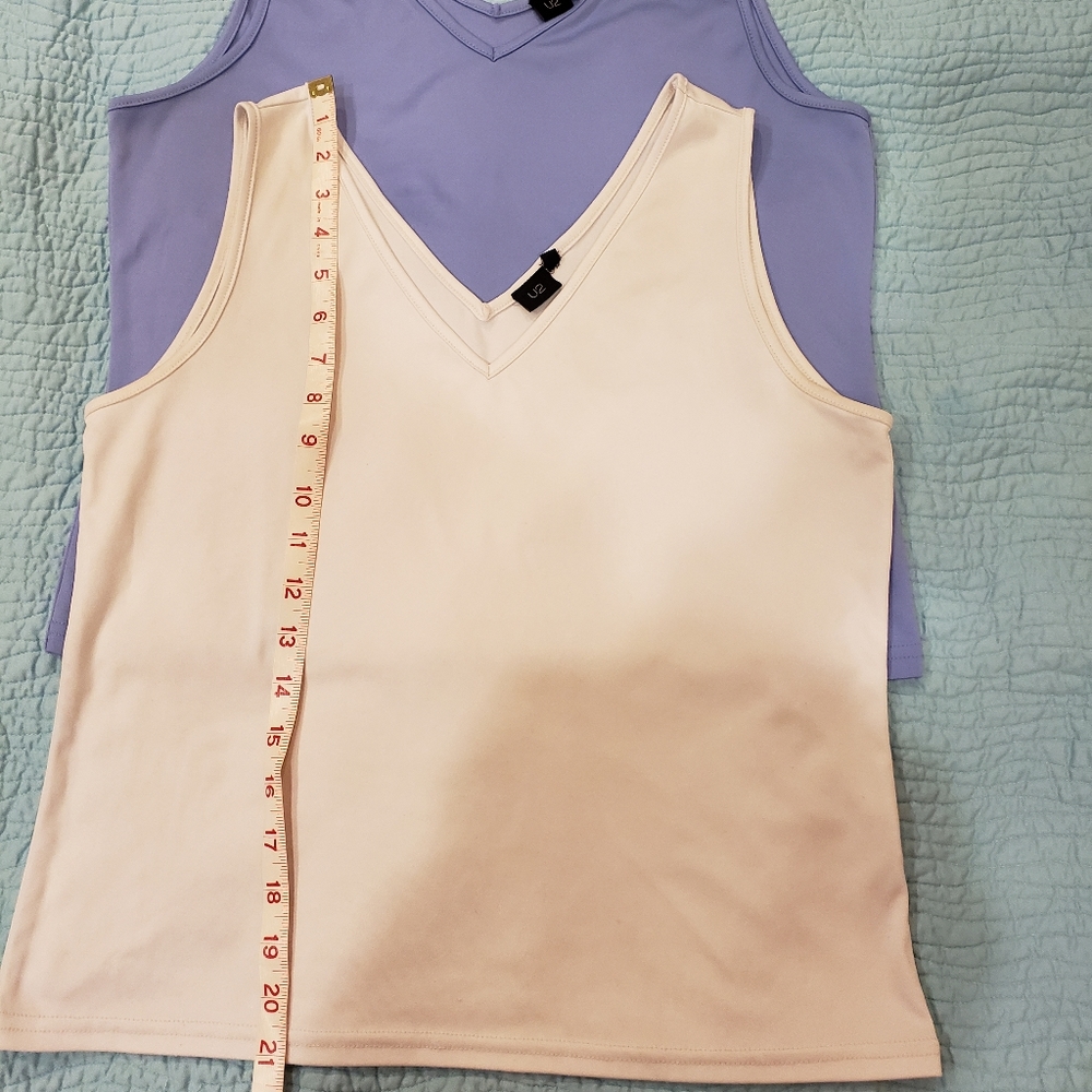 Pair of white and light blue sleeveless tops